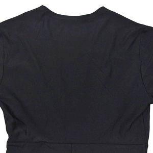 Detailed close-up showing the neckline and shoulder seam of a black V-neck fitted dress