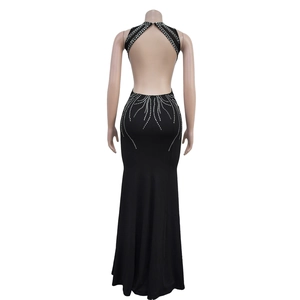 Detail of black backless evening gown with sparkling rhinestones and fishtall design