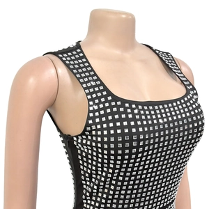 Detail view of sparkly silver rhinestones on a black bodycon party dress with side zipper