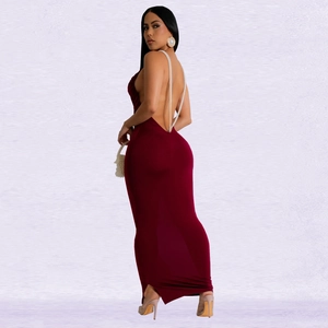 Detail of burgundy backless dress featuring elegant pearl chain cross straps and slim fit