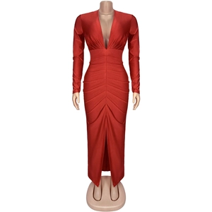 Close-up of red V-neck maxi dress featuring slim fit long sleeves and elegant front slit