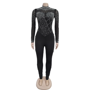 Close-up detail of sheer mesh sleeves and bodice with sparkling silver rhinestones