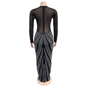 Detail of the back zipper and rhinestone pattern on a black mesh long sleeve maxi dress