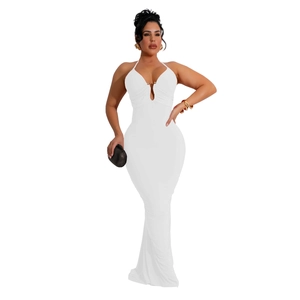 Detail of white halter neck maxi dress with deep V-neckline and gold buckle accent