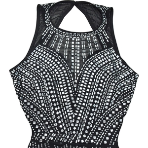 Close-up of black halter dress featuring sparkling silver rhinestones and mesh patchwork
