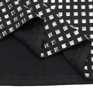 Detail of black rhinestone evening dress showing high-quality stitching and sparkling gems