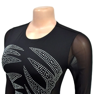 Detailed close-up of sparkling silver rhinestones on sheer mesh sleeve and black bodice