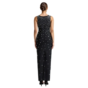 Detail of elegant black bodycon dress featuring rhinestone droplets and a back zipper closure