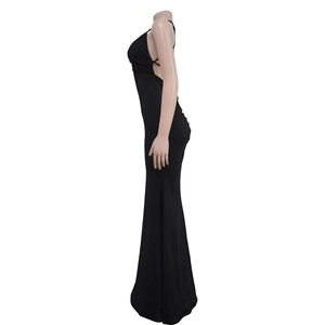 Side view of sleek black backless evening gown with floor-length hem and bodycon fit