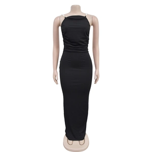 Detail of elegant black bodycon dress with white pearl straps and backless design