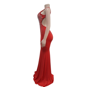Detail of red mermaid dress showing side cutout and silver rhinestones on elastic fabric