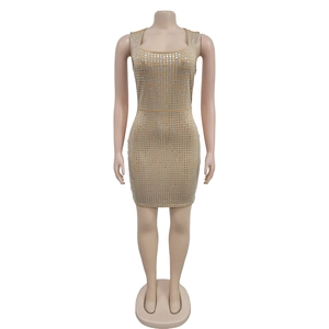 Detailed view of silver square rhinestones on a gold bodycon mini evening dress