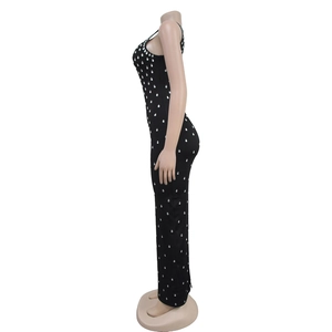 Side view of black bodycon dress featuring shimmering silver rhinestones and sleek fit