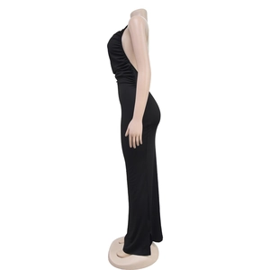 Detail of sexy black bodycon dress with white pearl halter chain and side split design