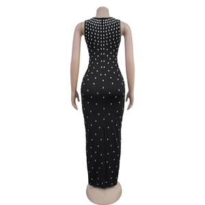 Detail of black rhinestone sleeveless dress featuring back slit and teardrop crystal decor