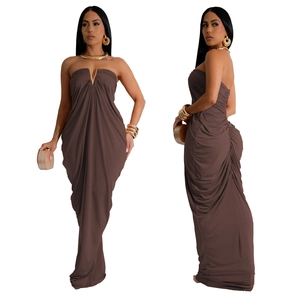 Deep brown ruched maxi dress featuring a gold metallic V-shaped accent and sleek draping