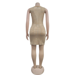 Detail back view of a slim fit nude dress with silver rhinestone square patterns