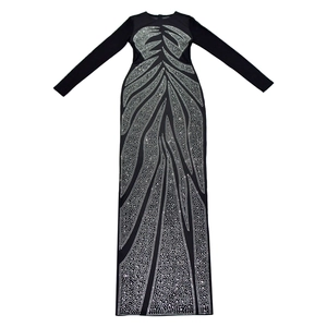 Close-up of sparkling silver rhinestones and mesh inserts on a black bodycon dress