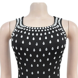 Detail of u-neck sleeveless black dress with sparkling rhinestone teardrop patterns
