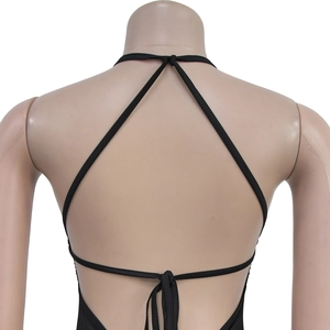 Detail of black V-neck backless dress with cross straps and tie-up bow on the back