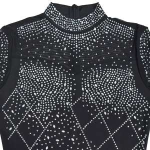 Detail of sheer mesh neckline with shimmering rhinestones on black bodysuit