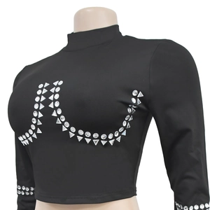 Detail of black long sleeve crop top featuring silver geometric rhinestone embellishments
