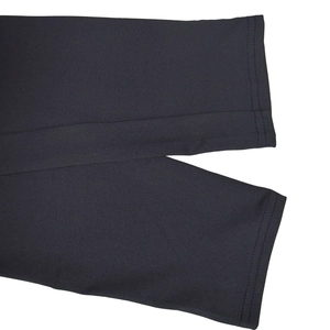 Detail of the double-stitched cuff on a black mesh long-sleeve jumpsuit for women