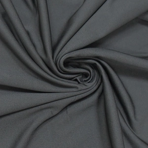 Close-up of charcoal gray knit fabric texture with soft drape and fine weave structure