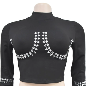 Detail of black long sleeve crop top featuring silver geometric rhinestone embellishments