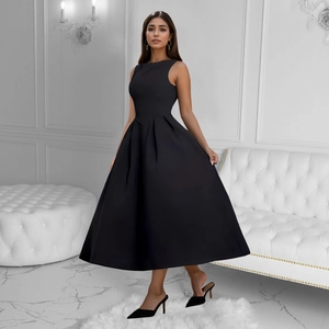 Detail of elegant black sleeveless A-line dress with smooth satin fabric and pleated hemline