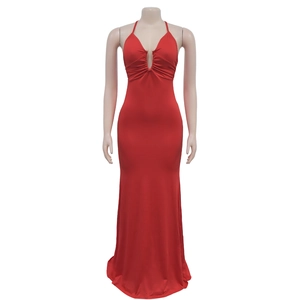 Detail of red halter neck maxi dress with pleated V-neck and delicate metal bead accents