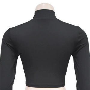Back view of a tight black long sleeve crop top with high neck collar and slim fit cut
