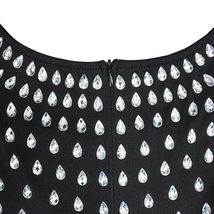 Detail of U-neck black dress showing rhinestone embellishments and hidden back zipper
