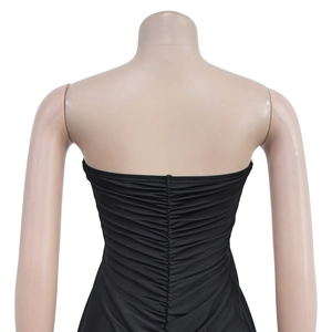 Detailed back view of a black ruched bodycon dress showing textured pleats on a mannequin