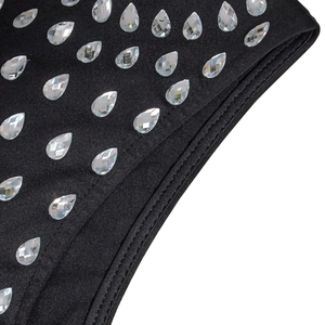 Detail of rhinestone embellishments and double-stitched seam on black bodycon dress