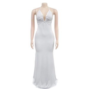 Detail of white halter neck maxi dress with deep V-neck and metal bead embellishments