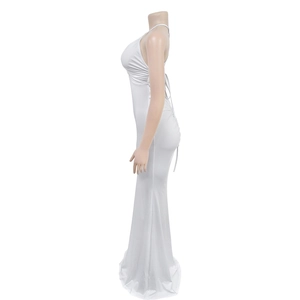 Detail view of the backless white satin dress featuring cross-strap back and slim fit silhouette