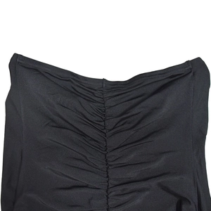 Detail of black ruched fabric texture with vertical pleats and flat seam finishing
