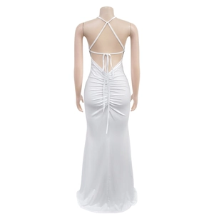 Detail of white backless dress with criss-cross straps and elegant ruched drawstring