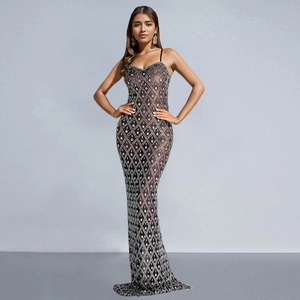 Close-up of sparkling silver rhinestones on a black sheer mesh bodycon maxi dress