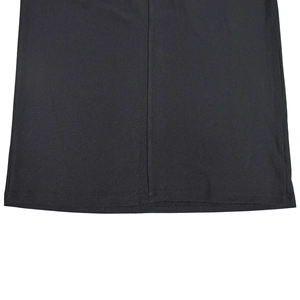 Detailed close-up of double-stitched hem and seam on black knitted evening dress