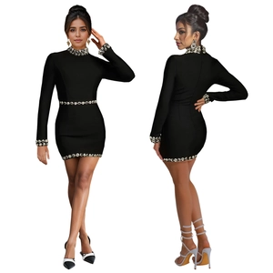 Slim fit black long sleeve mini dress with sparkling rhinestones and high neck detail