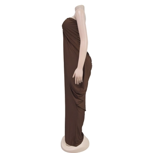 Detailed side view of dark brown floor-length slim fit tube dress with side pleat details