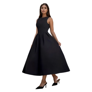 Detail of elegant black midi dress featuring structured waist and pleated skirt