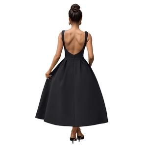 Detail of elegant backless black maxi dress showing deep U-shaped back and invisible zipper