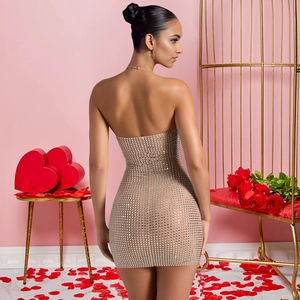 Close-up of sparkling square rhinestones on a sheer bodycon mini party dress