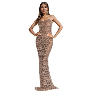 Detail of coffee-colored slim fit slip dress featuring diamond grid pattern and fishtail hem