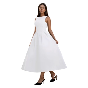Detailed view of white sleeveless midi dress featuring high neck and pleated waist details