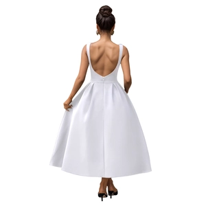 Detail of elegant white midi dress featuring a deep U-shaped backless design and A-line hem