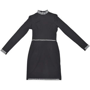 Detail of rhinestone embellishments on a slim-fit black long-sleeve dress neckline